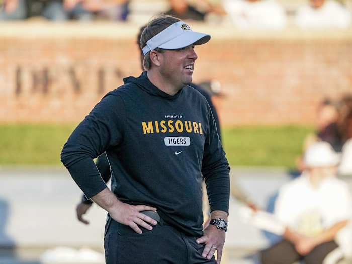 Missouri coach Eli Drinkwitz stands on the field