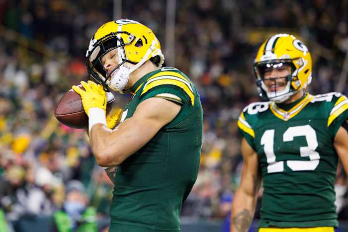 Green Bay Packers wide receiver Christian Watson (9) celebrates after scoring a touchdown during the fourth quarter against the Dallas Cowboys at Lambeau Field.
