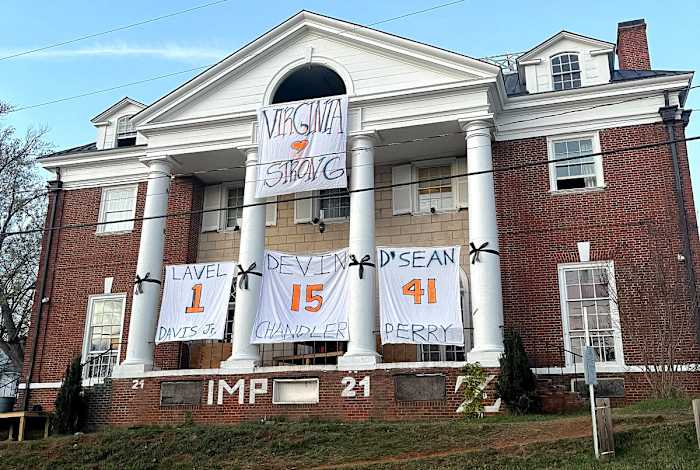 One of the many UVA frat houses paying tribute to three football players who were shot and killed on campus.