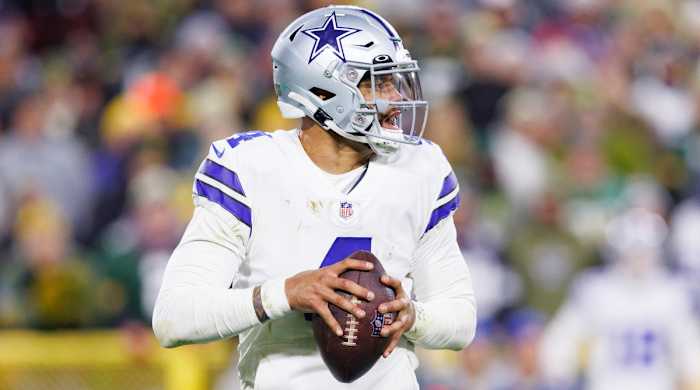 Dallas Cowboys quarterback Dak Prescott holds the ball
