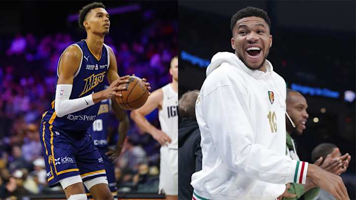 Victor Wembanyama shoots a free-throw, while Giannis Antetokounmpo laughs