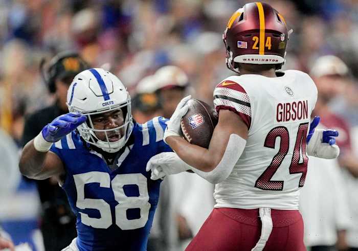 Washington Commanders running back Antonio Gibson (24) evades a tackle by Indianapolis Colts linebacker Bobby Okereke (58) on Sunday, Oct. 30, 2022, during a game against the Washington Commanders at Indianapolis Colts at Lucas Oil Stadium in Indianapolis.