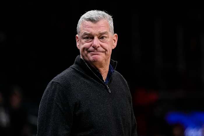 Tony Ressler stands courtside.