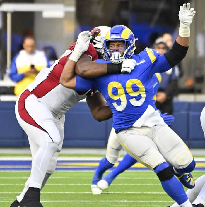 Los Angeles Rams defensive tackle Aaron Donald (99) slips past Arizona Cardinals guard Lecitus Smith (54) to get to quarterback Colt McCoy (not pictured). Mandatory Credit: Robert Hanashiro-USA TODAY Sports