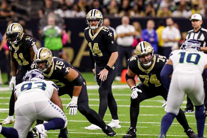 New Orleans, Louisiana, USA; New Orleans Saints quarterback Andy Dalton (14) looks over the Seattle Seahawks defense. Mandatory Credit: Stephen Lew-USA TODAY Sports