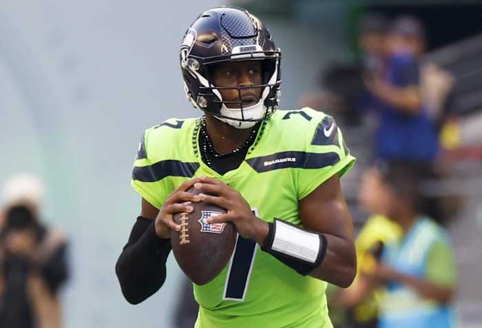 Seattle Seahawks quarterback Geno Smith (7) looks to pass against the Denver Broncos during the second quarter at Lumen Field.