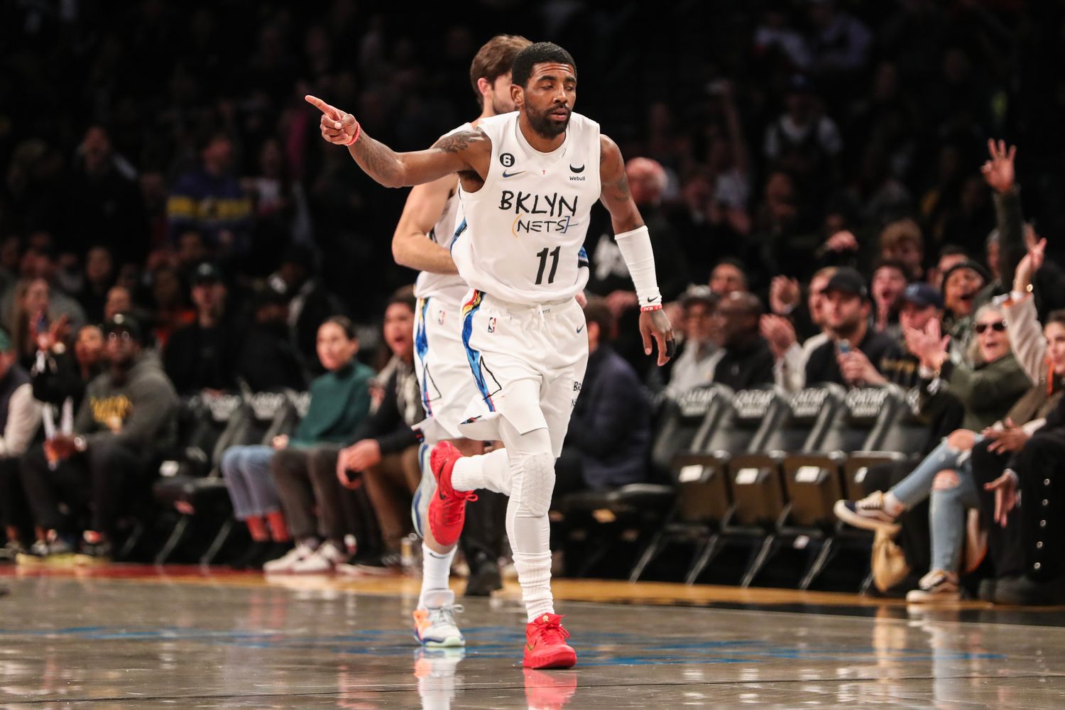 Kyrie Irving runs down the court.