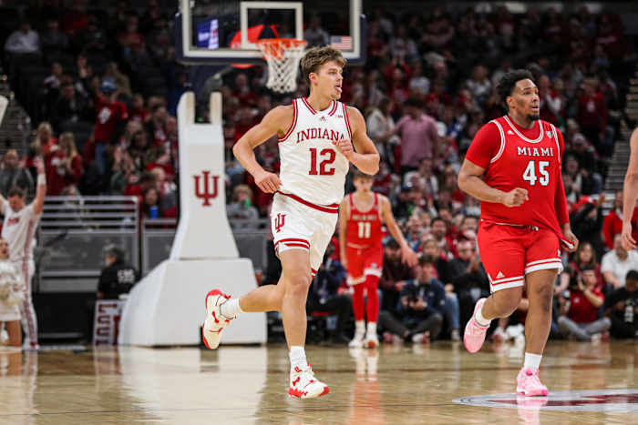 Miller Kopp wags his tongue while running upcourt after hitting a three-pointer on Sunday at Gainbridge Fieldhouse in Indianapolis. (Photo courtesy of IU Athletics)