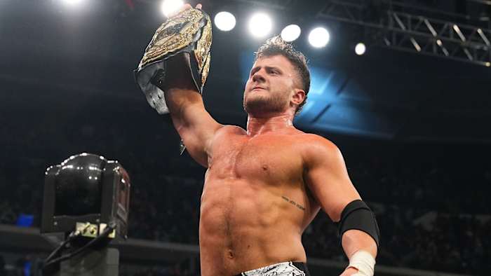 MJF poses with the AEW world championship after defeating Jon Moxley