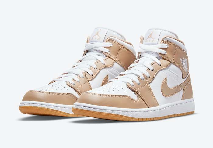 White and tan Air Jordan shoes.
