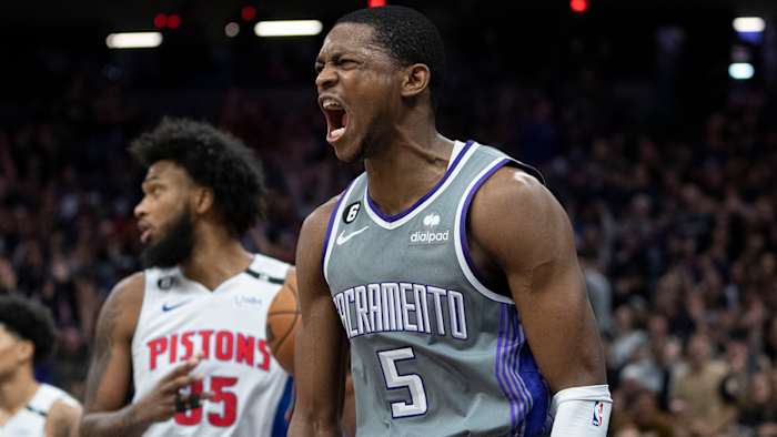 Sacramento Kings guard De'Aaron Fox celebrates after dunking the basketball against Detroit Pistons.