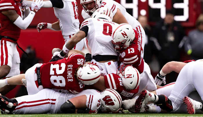 Malcolm Hartzog and Luke Reimer and Ty Robinson tackle vs Wisconsin 2022 Nebraska football