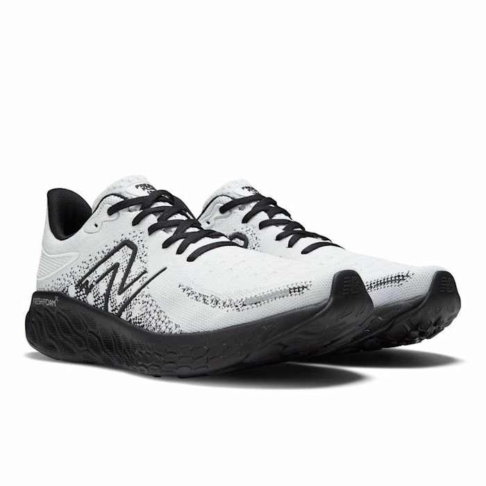 White and black New Balance running shoes.