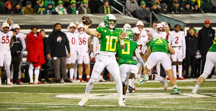 Oregon Quarterback Bo Nix throws a pass in the pocket.