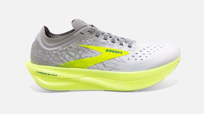 Grey and yellow Brooks running shoe.