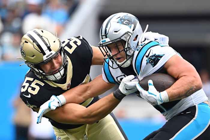 Sep 25, 2022; New Orleans Saints linebacker Kaden Elliss (55) tackles Carolina Panthers running back Christian McCaffrey (22). Mandatory Credit: Bob Donnan-USA TODAY Sports