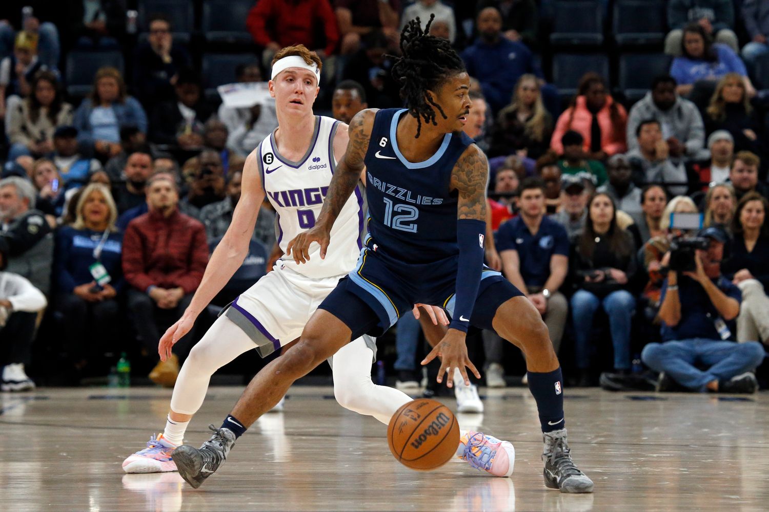 Grizzlies guard Ja Morant dribbles the ball.