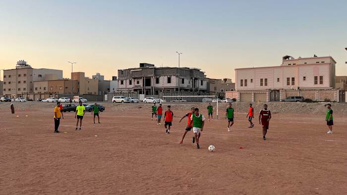 Saudi Arabians play soccer the day after the national team beat Argentina at the World Cup