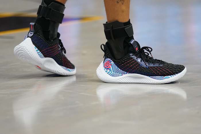 Black, blue, and white Curry shoes.