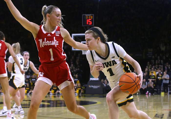 Iowa's Molly Davis drives to the basket as Nebraska's Jaz Shelley defends Saturday, Jan. 27, 2024 at Carver-Hawkeye Arena in Iowa City, Iowa.