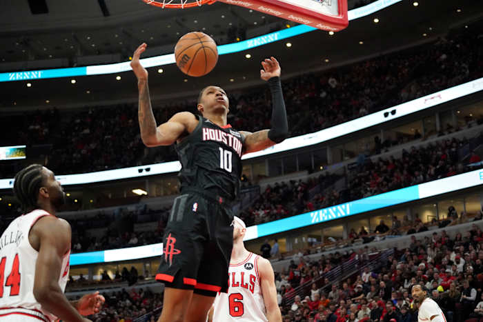 Rockets forward Jabari Smith Jr. completes a dunk on Chicago Bulls forward Patrick Williams (44) during the first quarter at United Center.