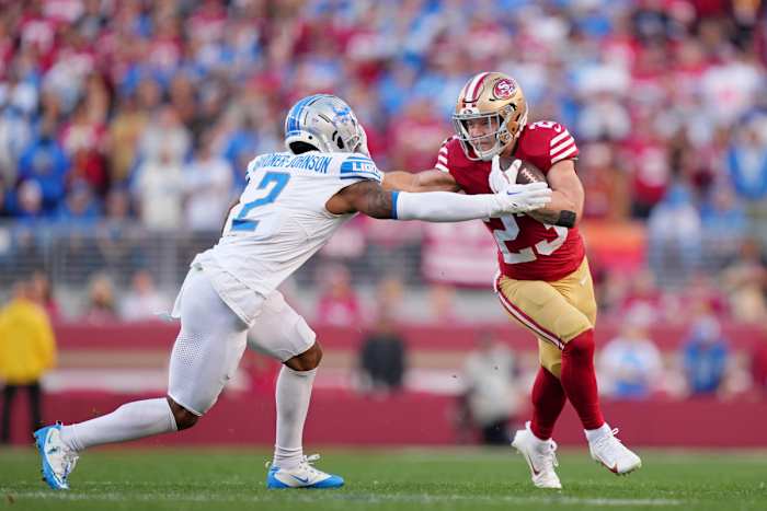 Jan 28, 2024; Santa Clara, California, USA; San Francisco 49ers running back Christian McCaffrey (23) stiff arms Detroit Lions safety C.J. Gardner-Johnson (2) during the first half of the NFC Championship football game at Levi's Stadium. Mandatory Credit: Kyle Terada-USA TODAY Sports 
