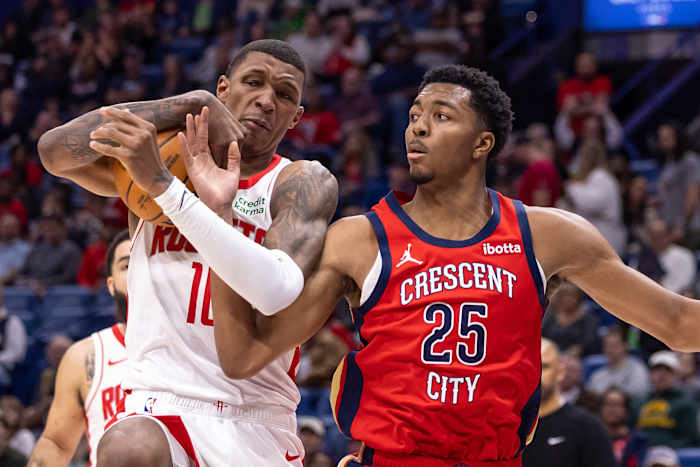 Rockets forward Jabari Smith Jr. (10) secures a rebound against New Orleans Pelicans guard Trey Murphy III (25) during the first half at Smoothie King Center.