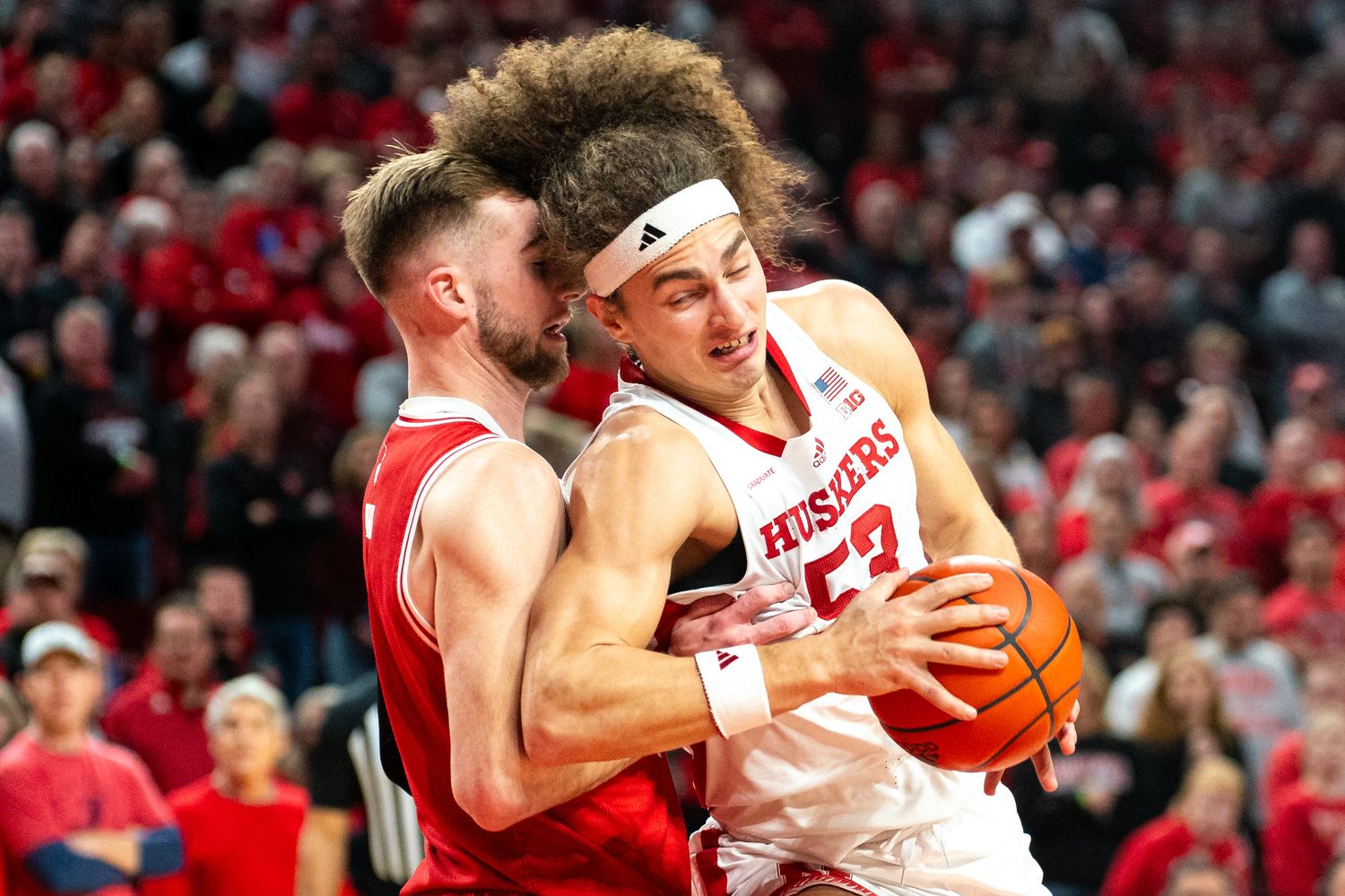 Feb 1, 2024; Lincoln, Nebraska, USA; Nebraska Cornhuskers forward Josiah Allick (53) drives against Wisconsin Badgers forward Tyler Wahl (5) during the first half at Pinnacle Bank Arena.