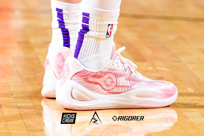 Los Angeles Lakers guard Austin Reaves' pink and white Rigorer sneakers.