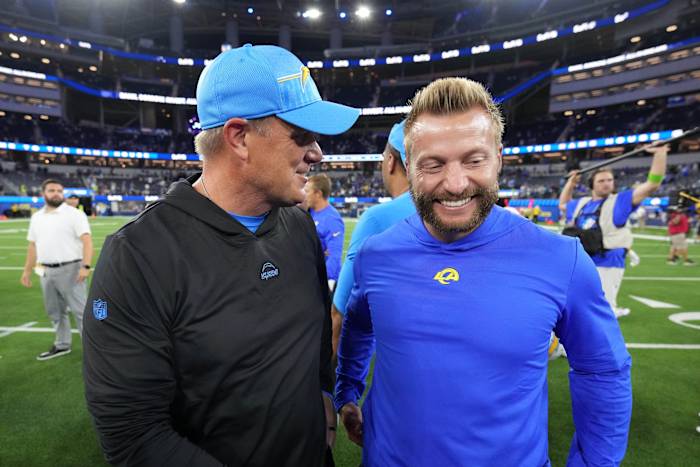 Aug 12, 2023; Inglewood, California, USA; Los Angeles Chargers defensive line coach Giff Smith (left) talks with Los Angeles Rams coach Sean McVay after the game at SoFi Stadium.