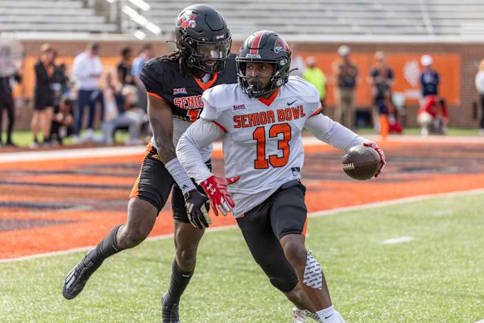 Feb 1, 2024; Mobile, AL, USA; American wide receiver Ryan Flournoy of Southeast Missouri (13) turns to the end zone after a pass catch against American defensive back Jarvis Brownlee Jr of Louisville (19) during practice for the American team at Hancock Whitney Stadium.