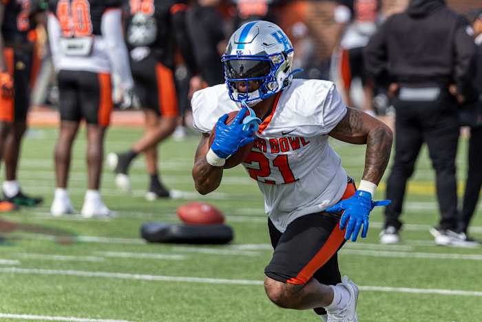 Feb 1, 2024; Mobile, AL, USA; American running back Ray Davis of Kentucky (21) works in running drills during practice for the American team at Hancock Whitney Stadium.