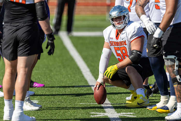 Jan 30, 2024; Mobile, AL, USA; National offensive lineman Jackson Powers-Johnson of Oregon (58) sets up a play during practice for the National team at Hancock Whitney Stadium.
