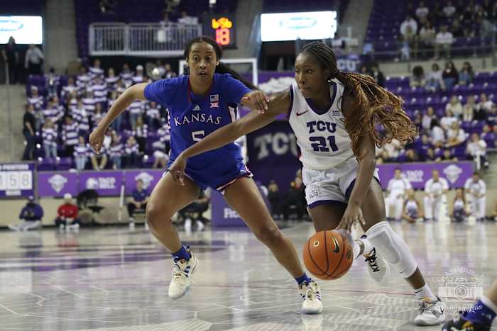 Agnes Emma-Nnopu drives to the basket against Kansas.