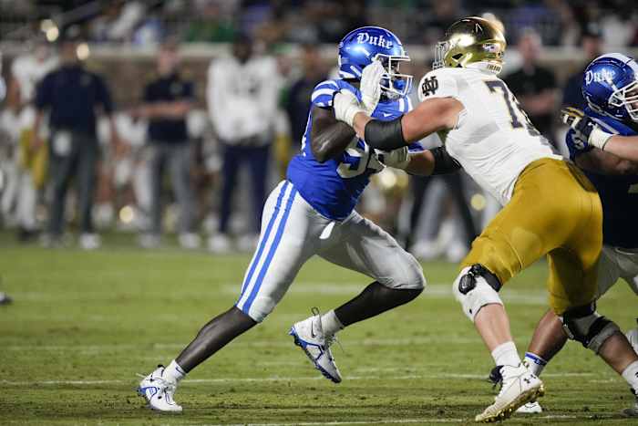 Sep 30, 2023; Durham, North Carolina, USA; Duke Blue Devils defensive end R.J. Oben (94) tries to get past the block of Notre Dame Fighting Irish offensive lineman Joe Alt (76) during the second half at Wallace Wade Stadium. Mandatory Credit: Jim Dedmon-USA TODAY Sports  
