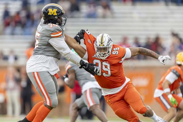 Feb 3, 2024; Mobile, AL, USA; American offensive lineman Javon Foster of Missouri (75) battle National edge Marshawn Kneeland of Western Michigan (99) during the second half of the 2024 Senior Bowl football game at Hancock Whitney Stadium. Mandatory Credit: Vasha Hunt-USA TODAY Sports  