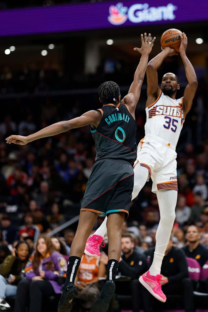 Phoenix Suns forward Kevin Durant (35) shoots the ball over Washington Wizards guard Bilal Coulibaly (0) in the first half at Capital One Arena.