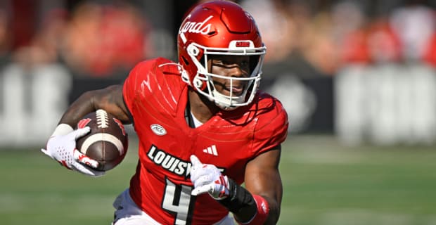 Louisville Cardinals running back Maurice Turner, Jr. on a rushing attempt during a college football game in the ACC.