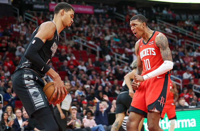 Rockets forward Jabari Smith Jr. (10) and San Antonio Spurs center Victor Wembanyama (1) react after Smith scores a basket during the second quarter at Toyota Center.