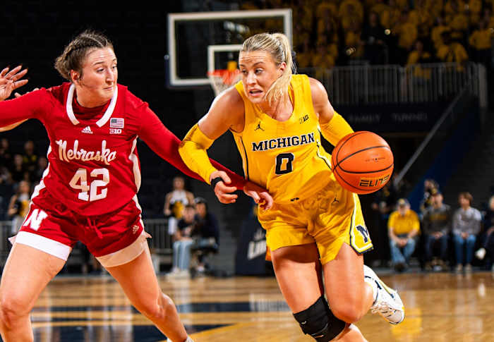 Nebraska's Maddie Krull defends as Michigan's Elissa Brett handles the ball Tuesday night in Ann Arbor, Michigan.
