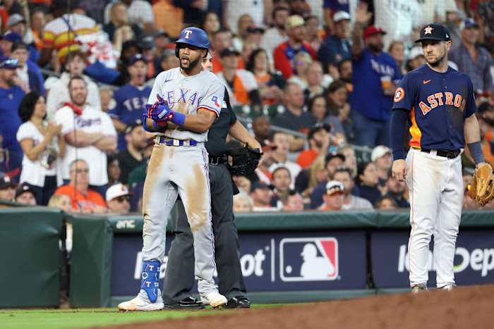 Texas Rangers center fielder Leody Taveras reacts at third after hitting a triple in the sixth inning against the Houston Astros during Game 2 of the ALCS at Minute Maid Park.