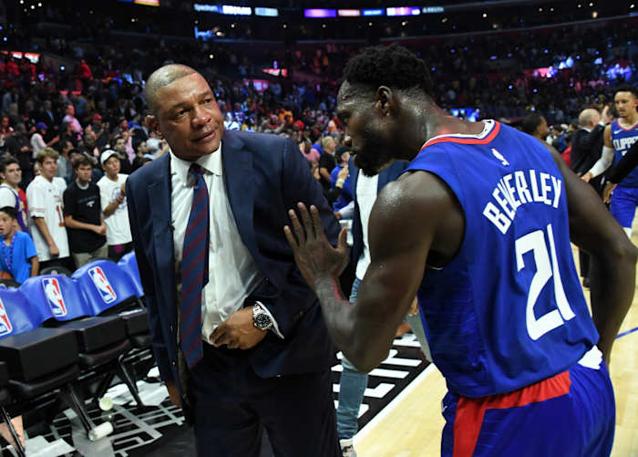 LA Clippers coach Doc Rivers (left) and guard Patrick Beverley (21) celebrate after the game against the Los Angeles Lakers