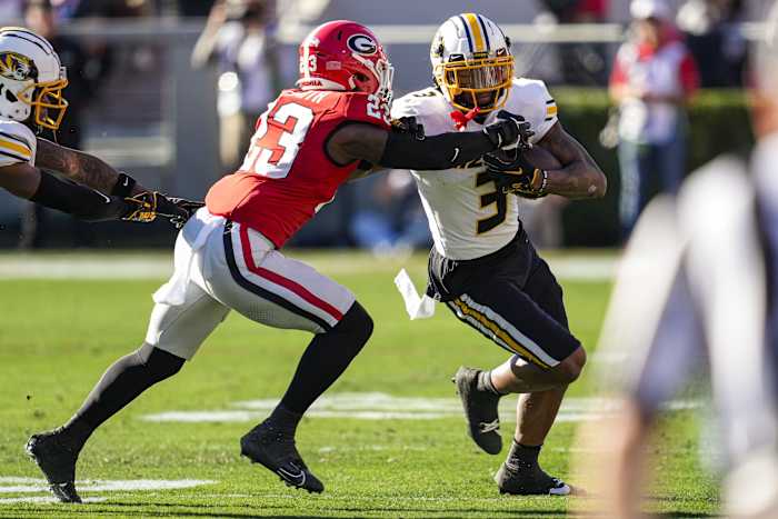 Nov 4, 2023; Athens, Georgia, USA; Missouri Tigers wide receiver Luther Burden III (3) runs against Georgia Bulldogs defensive back Tykee Smith (23) during the first half at Sanford Stadium. Mandatory Credit: Dale Zanine-USA TODAY Sports