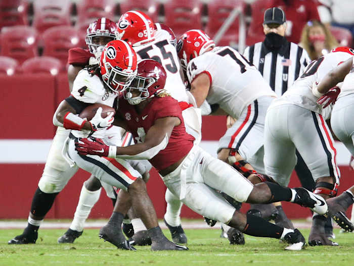 Alabama linebacker Christopher Allen (4) tackles Georgia running back James Cook (4) for a loss during Alabama's 41-24 win over Georgia in Bryant-Denny Stadium Saturday, Oct. 17, 2020.