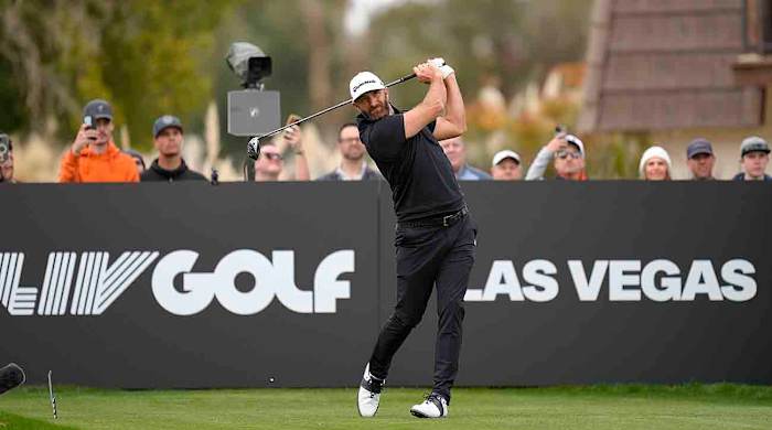 Dustin Johnson plays his shot from the 14th tee during the second round of the 2024 LIV Golf Las Vegas tournament at Las Vegas Country Club.