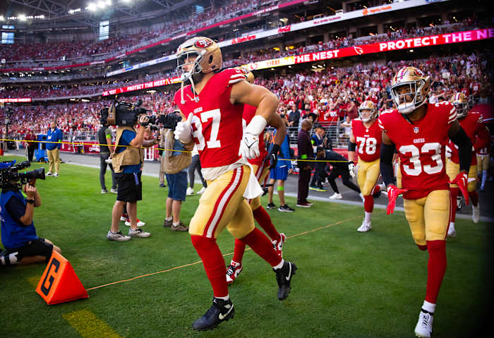 San Francisco 49ers defensive end Nick Bosa runs onto the field.