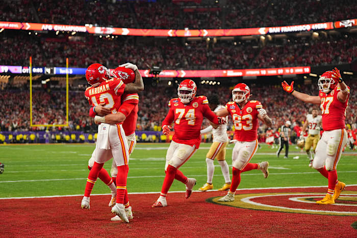 Mecole Hardman Jr. jumps to hug his teammates in the end zone