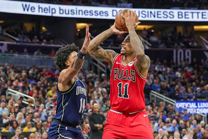 Chicago Bulls forward DeMar DeRozan (11) shoots the ball against Orlando Magic guard Gary Harris (14) during the second half at KIA Center.