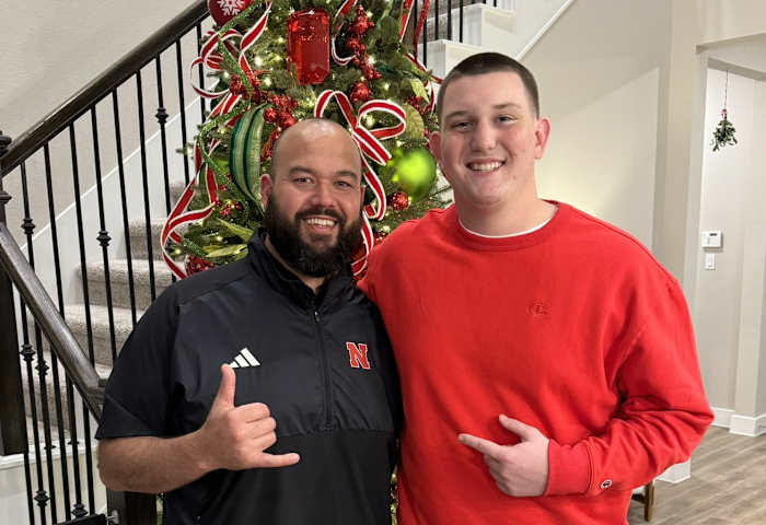 Gibson Pyle with Nebraska offensive line coach Donovan Raiola.