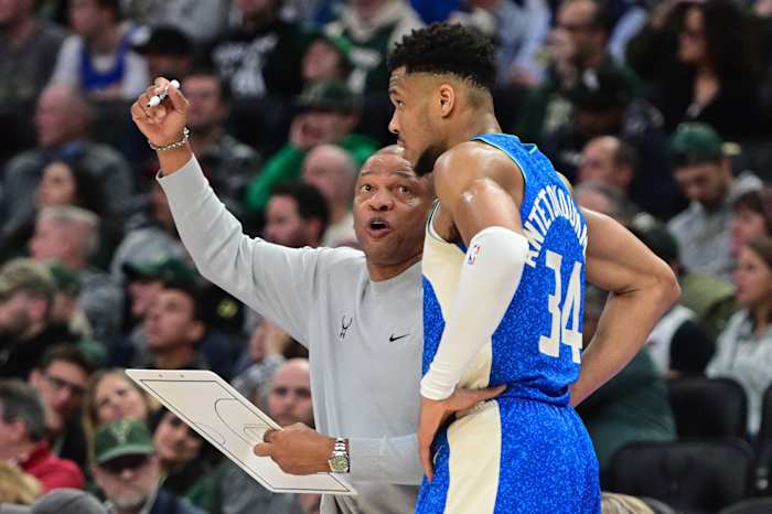 Milwaukee Bucks head coach Doc Rivers draws up a play with forward Giannis Antetokounmpo (34) 